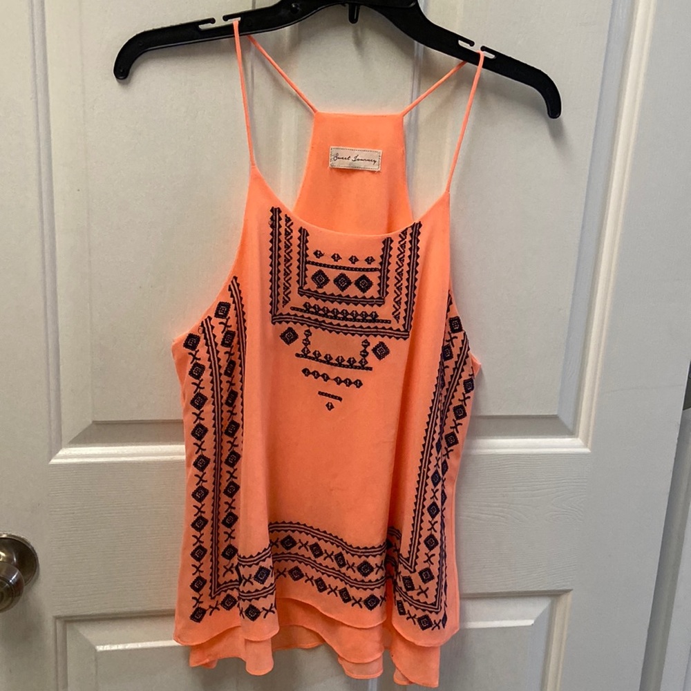 Medium orange with navy blue design razor back tank
